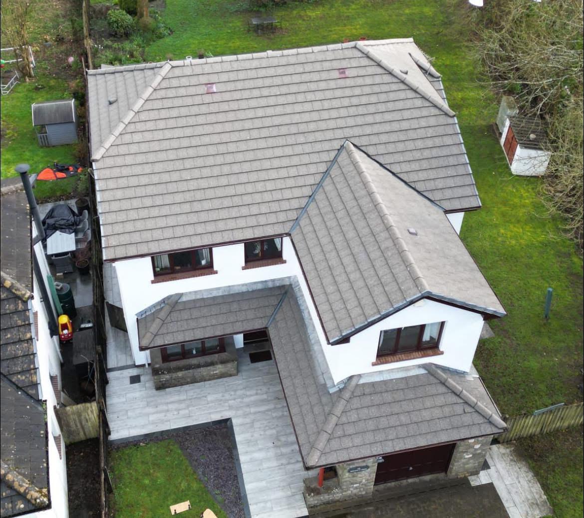 Aerial after shot of the same pitched roof following full roof clean