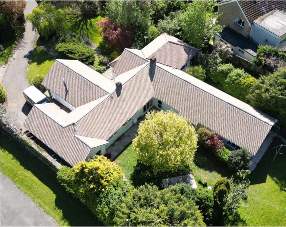 Detached house roof after JPE roof cleaning — clean tiles restored