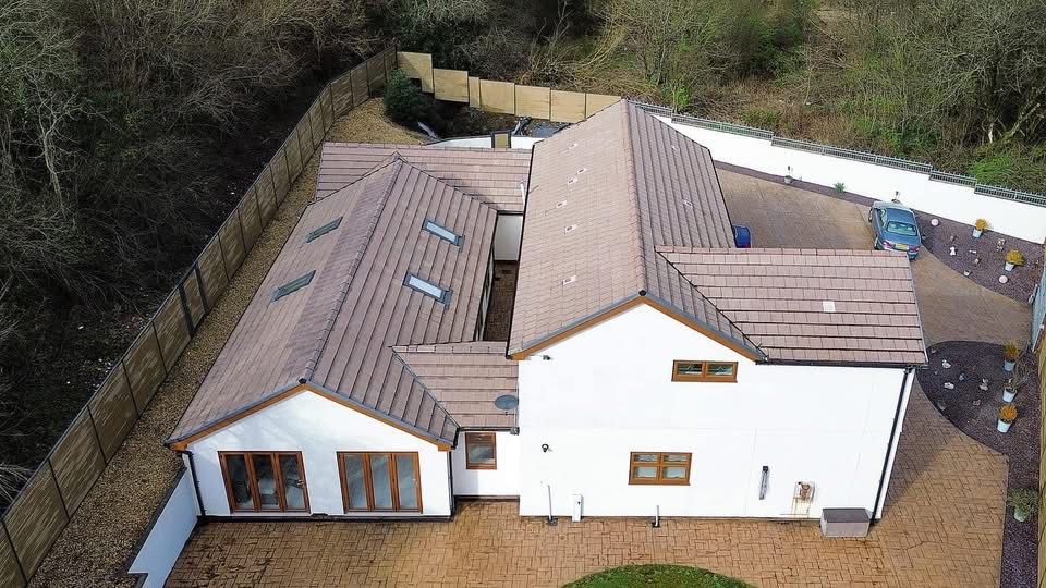 Aerial after photo of a moss-free tiled roof cleaned by JPE Cleaning Services in South Wales