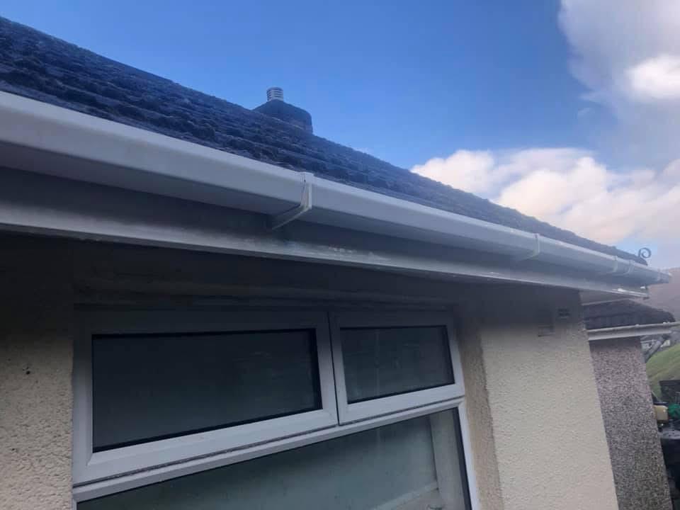 White uPVC fascias and soffits restored to bright white after JPE fascia cleaning in South Wales