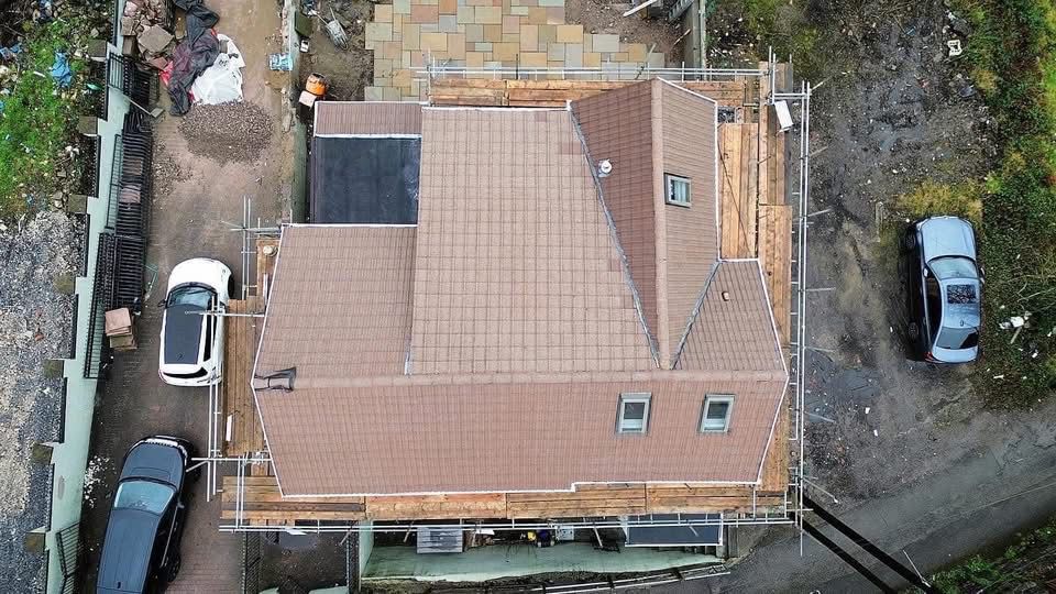 Same roof after moss removal and softwashing — aerial after photo
