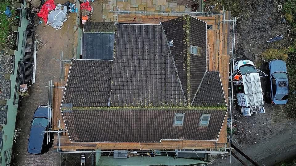 Moss-covered tiled roof before cleaning — aerial view, South Wales