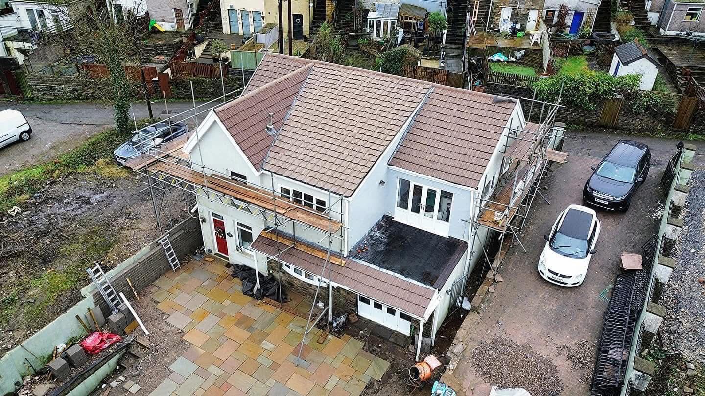 Aerial after photo of a fully cleaned tiled roof following JPE moss removal and softwashing in South Wales